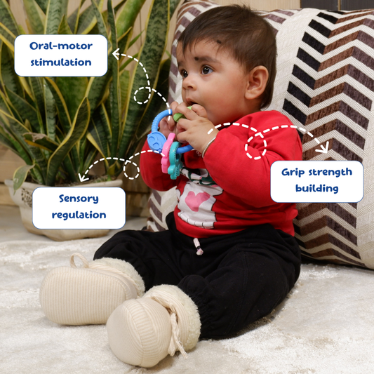 Baby sitting on a rug with a teething toy, surrounded by text labels on oral-motor stimulation, sensory regulation, and grip strength building.