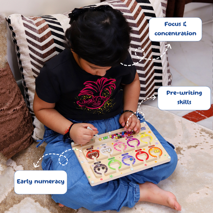 Child playing with a educational puzzle toy on a couch