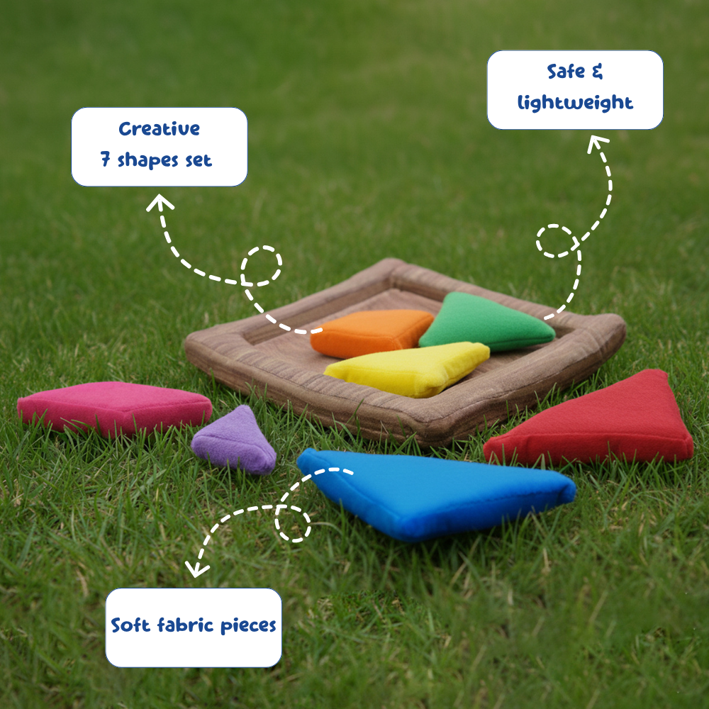 Colorful fabric shapes on a tray with grass background