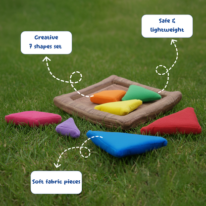 Colorful fabric shapes on a tray with grass background