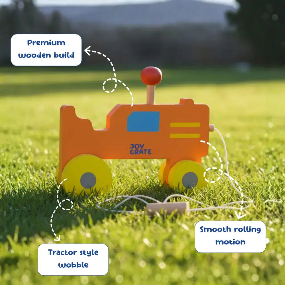 Wooden toy tractor on grass with features highlighted