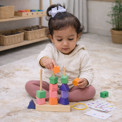Child playing with a colorful wooden shape sorter toy on a carpeted floor.